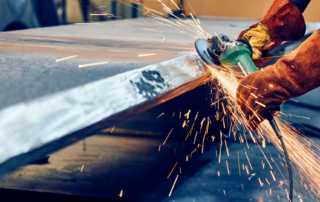 worker using grinding wheel