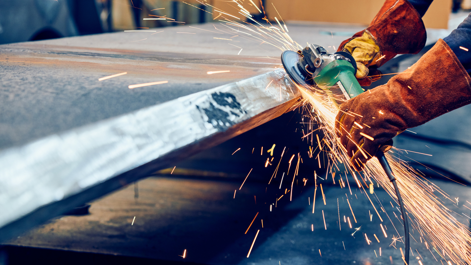 worker using grinding wheel